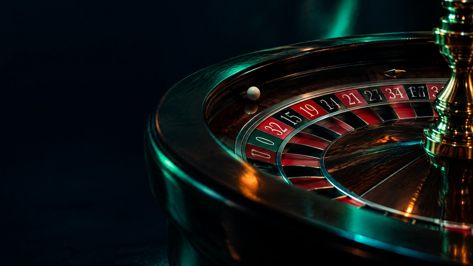 Roulette wheel with numbered pockets and a white ball beside a rules scorecard